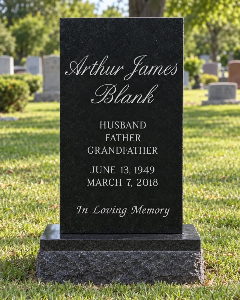 Jet Black Jewish headstone with script lettering on a polished face.